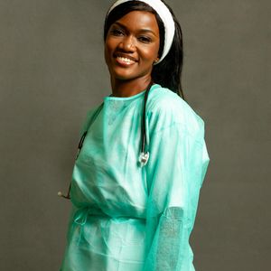 Professional fitness practitioner Svitlana smiling in a training gear.